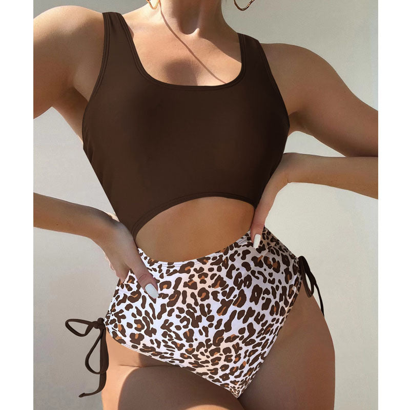 bikini set with brown top and brown and white leopard print bottoms. Bottoms have tie detail
